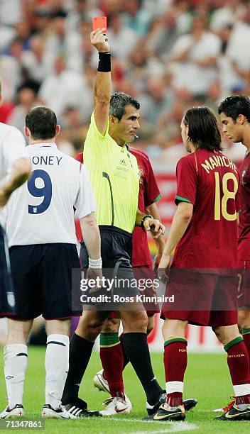 Wayne Rooney of England is shown a red card by Referee Horacio Elizondo of Argentina during the FIFA World Cup Germany 2006 Quarter-final match...