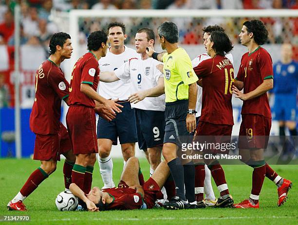 Wayne Rooney of England clashes with the Portuguese players before being sent off by Referee Horacio Elizondo of Argentina during the FIFA World Cup...