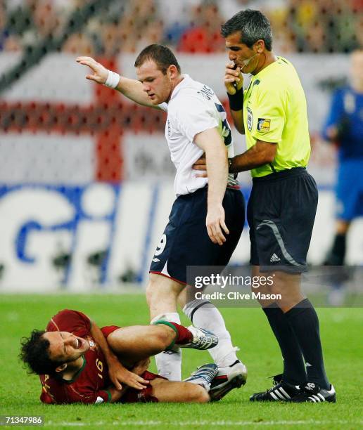 Referee Horacio Elizondo of Argentina blows his whistle after Wayne Rooney of England stamped on Ricardo Carvalho of Portugal during the FIFA World...