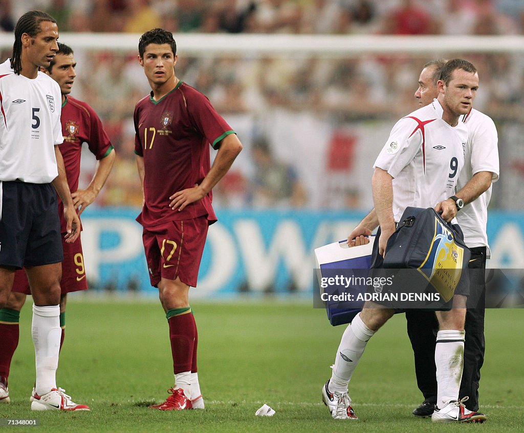 English forward Wayne Rooney (R) leaves