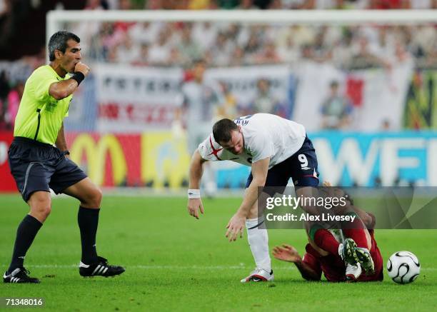 Wayne Rooney of England stamps on Ricardo Carvalho of Portugal during the FIFA World Cup Germany 2006 Quarter-final match between England and...