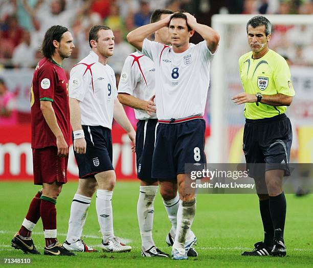 Frank Lampard of England reacts as team mate Wayne Rooney is sent off by Referee Horacio Elizondo of Argentina during the FIFA World Cup Germany 2006...