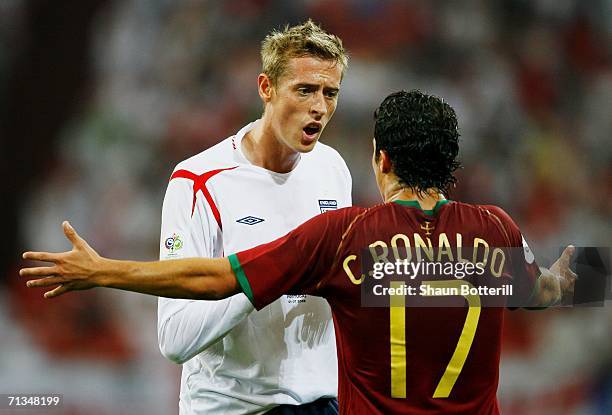 Peter Crouch of England argues with Cristiano Ronaldo of Portugal during the FIFA World Cup Germany 2006 Quarter-final match between England and...