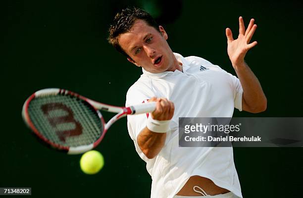 Philipp Kohlschreiber of Germany returns a forehand to Jarkko Nieminen of Finland during day six of the Wimbledon Lawn Tennis Championships at the...