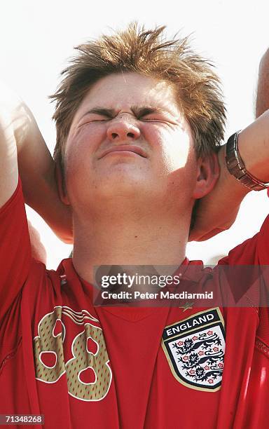 An England football fan holds his head at the Fan Fest on July 1, 2006 in Gelsenkirchen, Germany. England are playing Portugal in the FIFA World Cup...