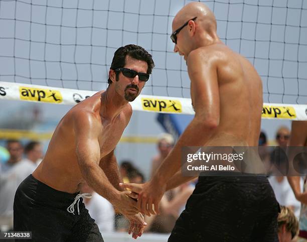 Todd Rogers celebrates a point with Phil Dalhausser during the AVP Seaside Heights Open on July 1, 2006 in Seaside Heights, New Jersey.