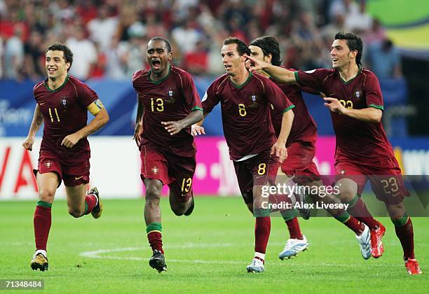 The Portugal players celebrate following their victory in a penalty shootout at the end of the FIFA World Cup Germany 2006 Quarter-final match...