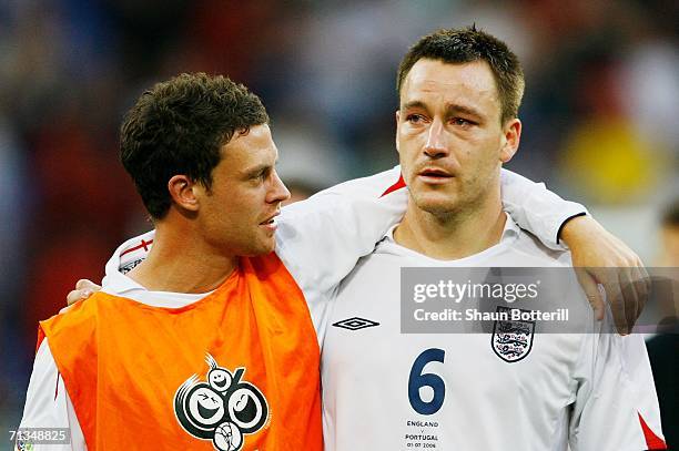 Wayne Bridge consoles England team mate John Terry following defeat during the FIFA World Cup Germany 2006 Quarter-final match between England and...