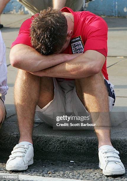 An England football supporter sits on the kerb after the FIFA World Cup 2006 Quarter-final match between England and Portugal on July 1, 2006 in...