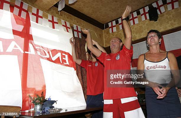 English football supporters react as their team score during penalties during the FIFA World Cup quarter final match with Portugal on July 1, 2006 in...