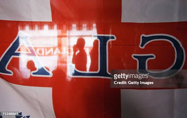 English football supporters watch as their team play out penalties during the FIFA World Cup quarter final match with Portugal on July 1, 2006 in a...