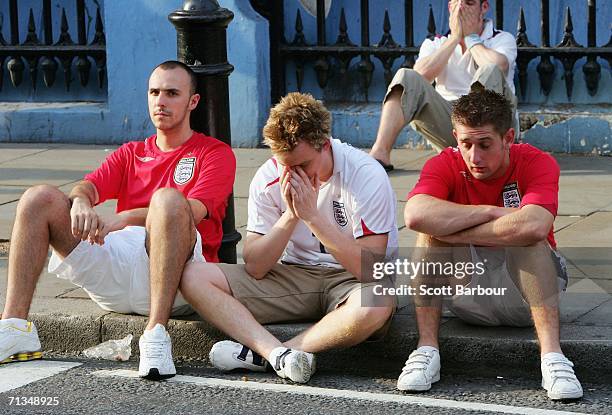 England supporters sit on the kerb after the FIFA World Cup 2006 Quarter-final match between England and Portugal on July 1, 2006 in central London,...