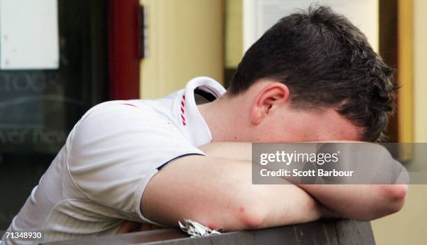 An England supporter holds his head in his arms after the FIFA World Cup 2006 Quarter-final match between England and Portugal on July 1, 2006 in...