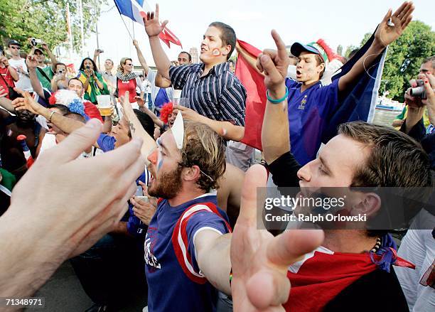French football fans cheer at a public viewing area ahead a live-broadcast on July 1, 2006 in Frankfurt, Germany. France play Brazil in the FIFA...