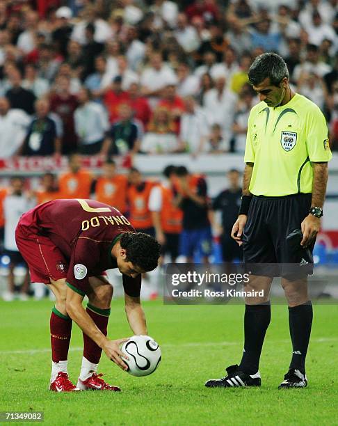 Cristiano Ronaldo of Portugal prepares to take the winning penalty in a penalty shootout under the watchful eye of Referee Horacio Elizondo during...