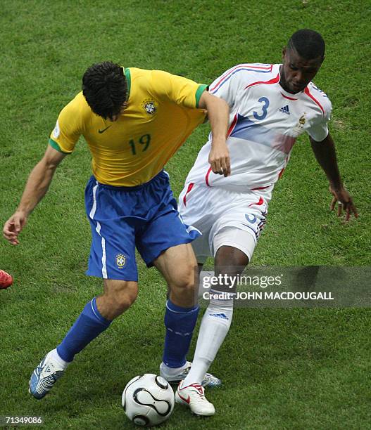 Frankfurt am Main, GERMANY: Brazilian midfielder Juninho Pernambucano vies with French defender Eric Abidal during the quarter-final World Cup...