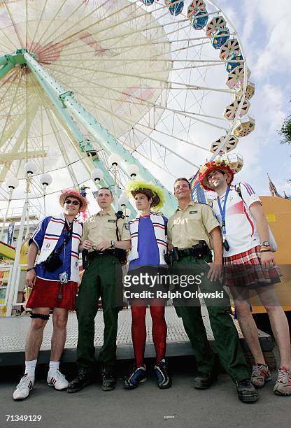 French football fans pose with German police officers on July 1, 2006 in Frankfurt, Germany. Brazil face France in a FIFA World Cup 2006 Quarter...