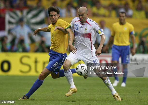 Kaka of Brazil and Zinedine Zidane of France compete for the ball during the FIFA World Cup Germany 2006 Quarter-final match between Brazil and...