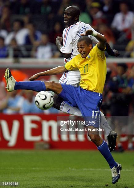 Gilberto Silva of Brazil battles for the ball with Lilian Thuram of France during the FIFA World Cup Germany 2006 Quarter-final match between Brazil...