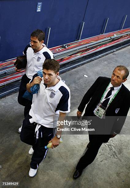 Frank Lampard and Steven Gerrard of England walk dejectedly to the team bus following defeat in the FIFA World Cup Germany 2006 Quarter-final match...