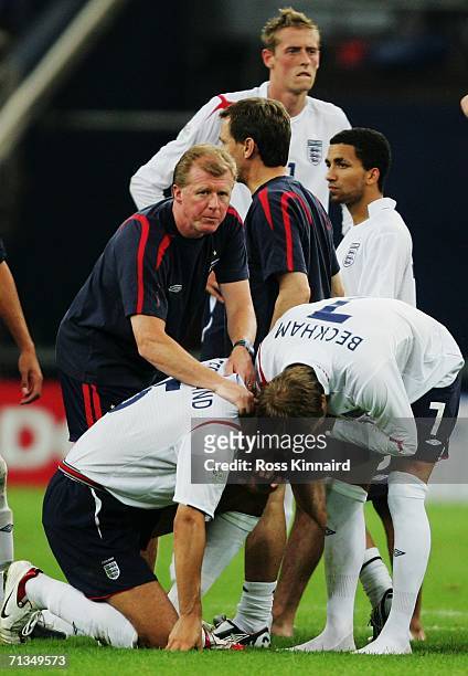 England Assistant Manager Steve McClaren consoles Rio Ferdinand and David Beckham at the end of the FIFA World Cup Germany 2006 Quarter-final match...