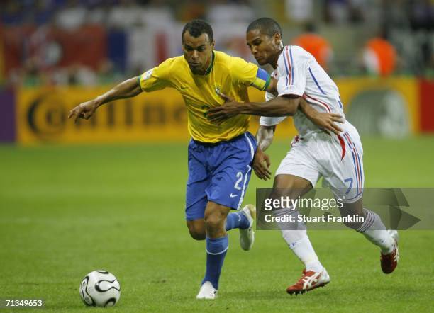 Cafu of Brazil battles for the ball with Florent Malouda of France during the FIFA World Cup Germany 2006 Quarter-final match between Brazil and...