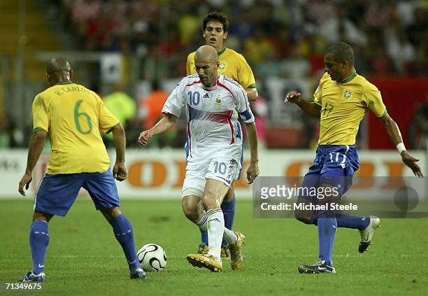 Zinedine Zidane of France is surrounded by Brazilian players during the FIFA World Cup Germany 2006 Quarter-final match between Brazil and France at...