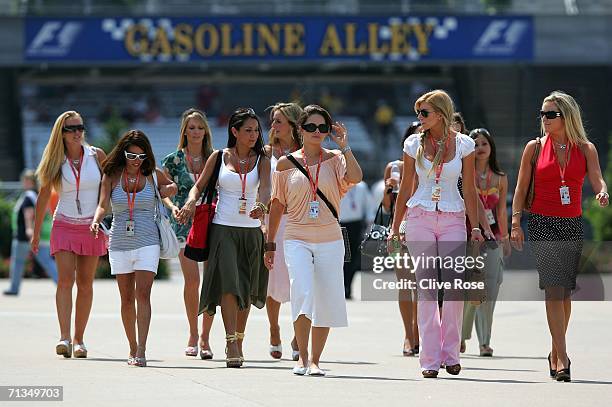 Women walk in the paddock after qualifying for the Formula One United States Grand Prix at Indianapolis Motor Speedway on July 1, 2006 in...