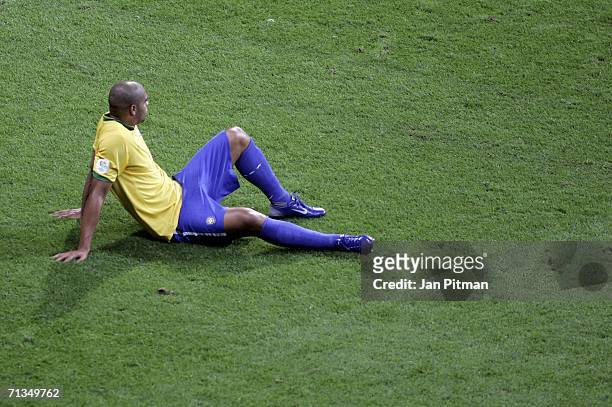 Dejected Adriano of Brazil sits on the pitch following his team's 1-0 defeat and exit from the competition during the FIFA World Cup Germany 2006...