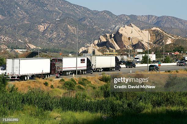 Trucks and cars move along Interstate 15 in Cajon Canyon near the San Andreas Fault on July 1, 2006 near San Bernardino, California. The freeway...