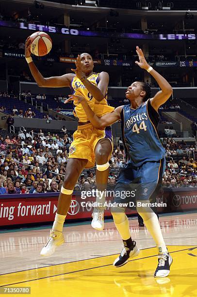 Lisa Leslie of the Los Angeles Sparks goes strong to the hoop against Chasity Melvin of the Washington Mystics at the Staples Center on July 1, 2006...