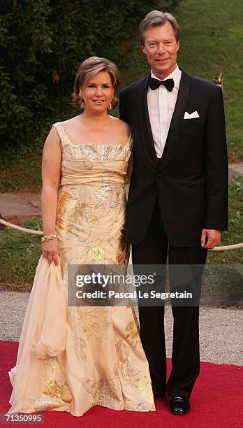 Duchess Maria Teresa of Luxembourg, Grand Duke Henri of Luxembourg pose as they arrive to attend a royal dinner that is part of the Grand Duke Henri...