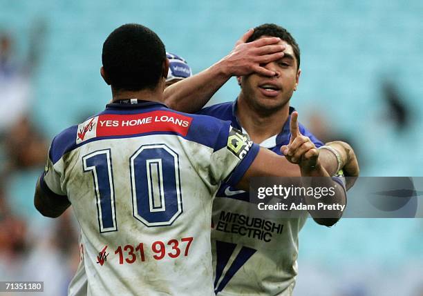 Willie Tonga of the Bulldogs is congratulated after his try during the round 17 NRL match between the Wests Tigers and the Bulldogs at Telstra...