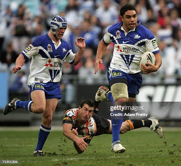 Willie Tonga of the Bulldogs on his way to scoring his try during the round 17 NRL match between the Wests Tigers and the Bulldogs at Telstra...