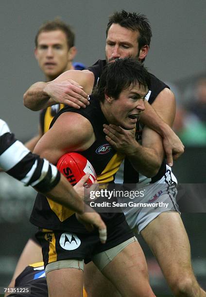 Andrew Raines for Richmond and Shane Wakelin for Collingwood in action during the round 13 AFL match between Richmond and Collingwood at the...