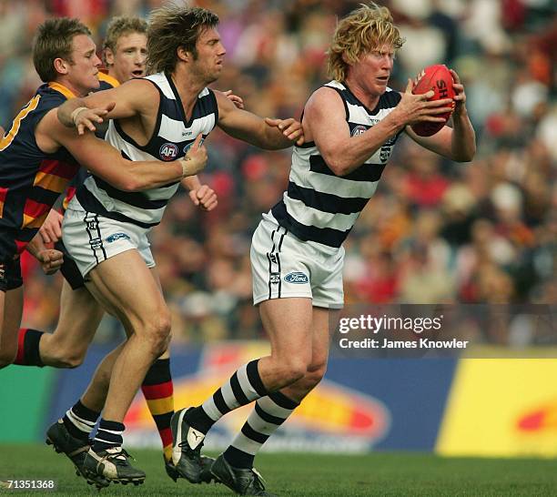 Cameron Ling of the Geelong comes under pressure during the round 13 AFL match between the Adelaide Crows and the Geelong at AAMI Stadium on July 2,...