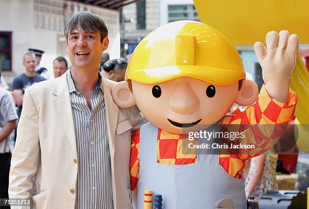 Neil Morrissey and Bob the Builder pose for photographs at the Bob The Builder - Built To Be Wild UK Premiere at the Odeon West End in Leicester...