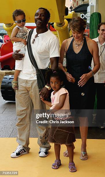 Former sprinter Linford Christie poses for photographs with his family at the Bob The Builder - Built To Be Wild UK Premiere at the Odeon West End in...