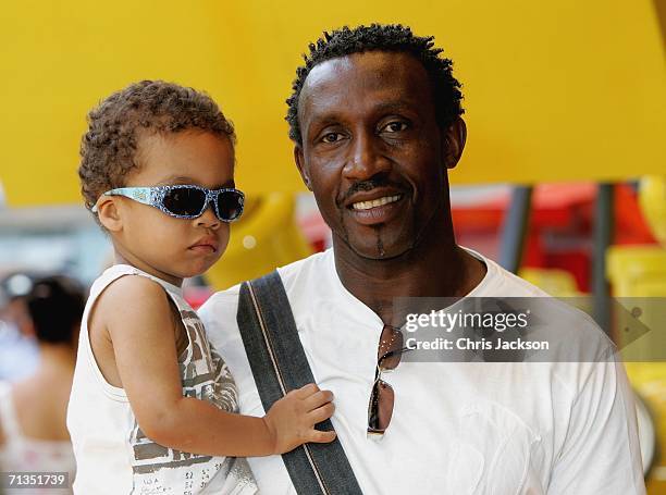 Former sprinter Linford Christie and his son pose for photographs at the Bob The Builder - Built To Be Wild UK Premiere at the Odeon West End in...