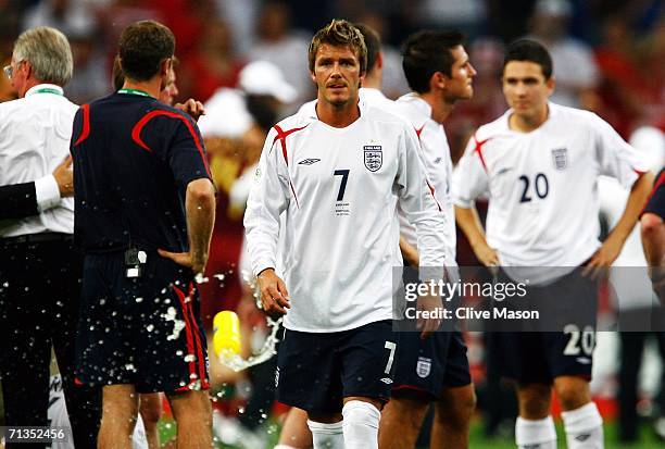 David Beckham of England looks dejected following defeat during the FIFA World Cup Germany 2006 Quarter-final match between England and Portugal...