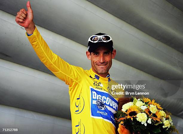 George Hincapie of the USA and the Discovery Channel team celebrates taking the yellow jersey after the first stage of the 2006 Tour de France from...