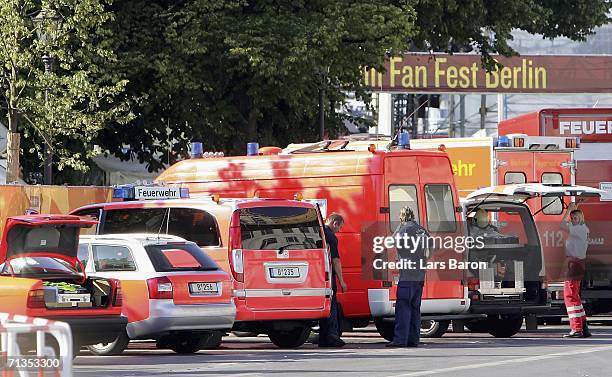 Ambulances are parked beside the access to the Fan Fest near the Brandenburg Gate, where several people suffered minor injuries when a car careered...