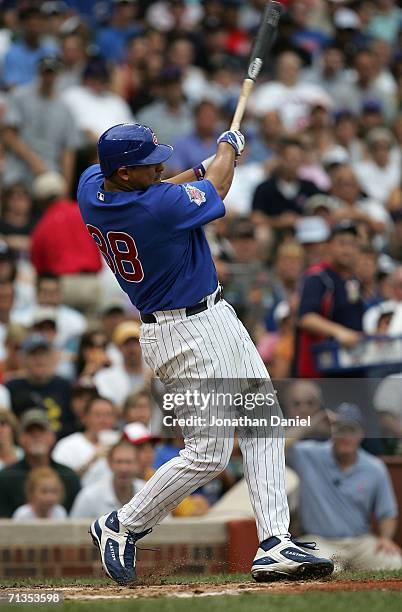 Starting pitcher Carlos Zambrano of the Chicago Cubs hits a two-run home run in the 1st inning against Mark Buehrle of the Chicago White Sox on July...