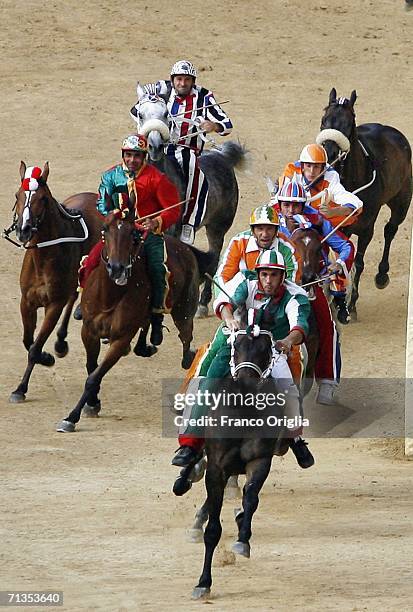 Jockeys and horses compete in the "Palio di Siena" on July 2, 2006 in Siena, Italy. The annual horse race and pageant which began in the 11th century...