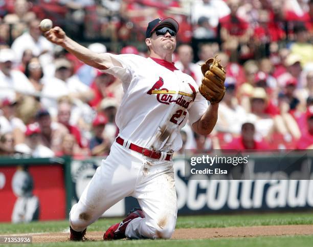 Scott Rolen of the St. Louis Cardinals fields the ball and sends it to first for the out against the Kansas City Royals on July 2, 2006 at Busch...