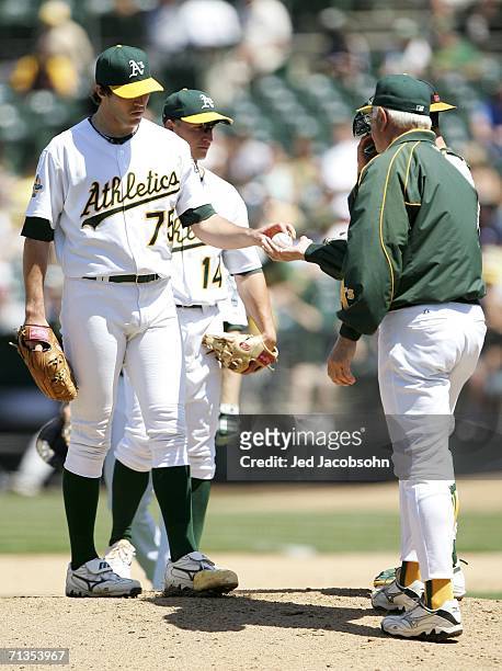 Manager Ken Macha of the Oakland Athletics pulls starting pitcher Barry Zito in the 9th inning of the game against the Arizona Diamondbacks at McAfee...