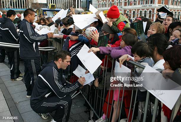 Reuben Thorne , Keven Mealamu and Doug Howlett sign autographs for fans in Cathedral Square on July 03, 2006 in Christchurch, New Zealand. The All...