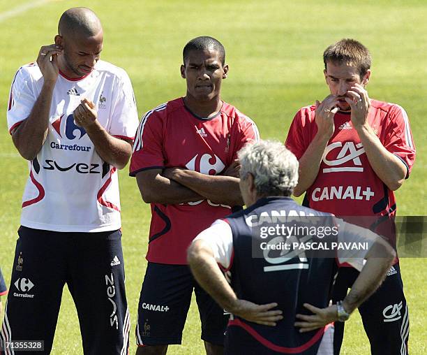 French head coach Raymond Domenech talks to his forwards Thierry Henry , Franck Ribery and midfielder Florent Malouda during a team training session...
