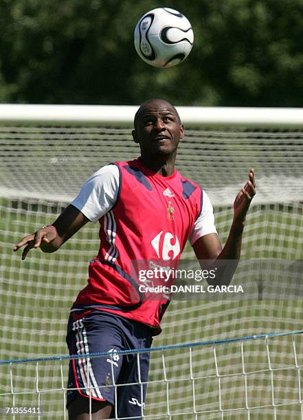 French midfielder Patrick Vieira heads the ball during a team training session at Weserbergland Stadium in Hameln, 03 July 2006. France 01 July...