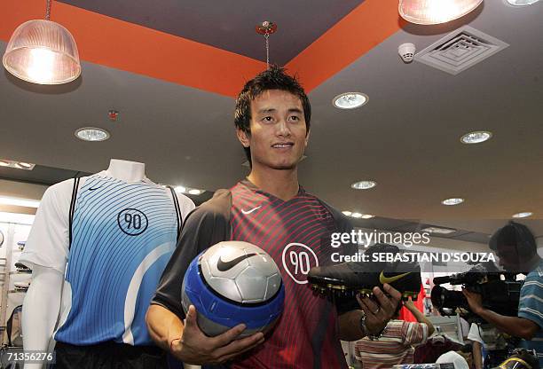 Indian footballer and Nike brand ambassador Baichun Bhutia launches the "Total 90" range of football products in Mumbai, 03 July 2006. The Total 90...